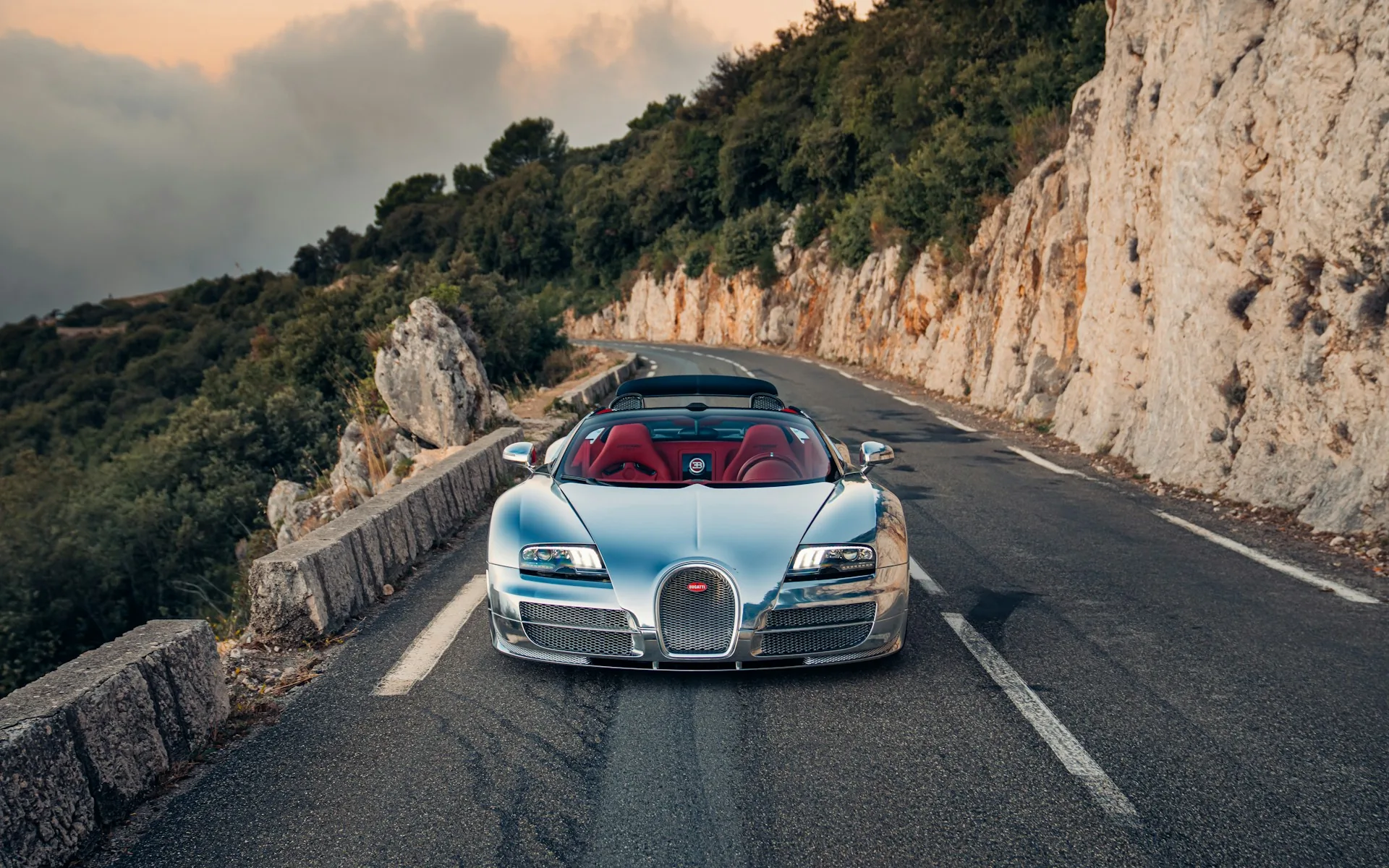 Front view of the aluminium Bugatti Veyron Grand Sport Vitesse between rock walls