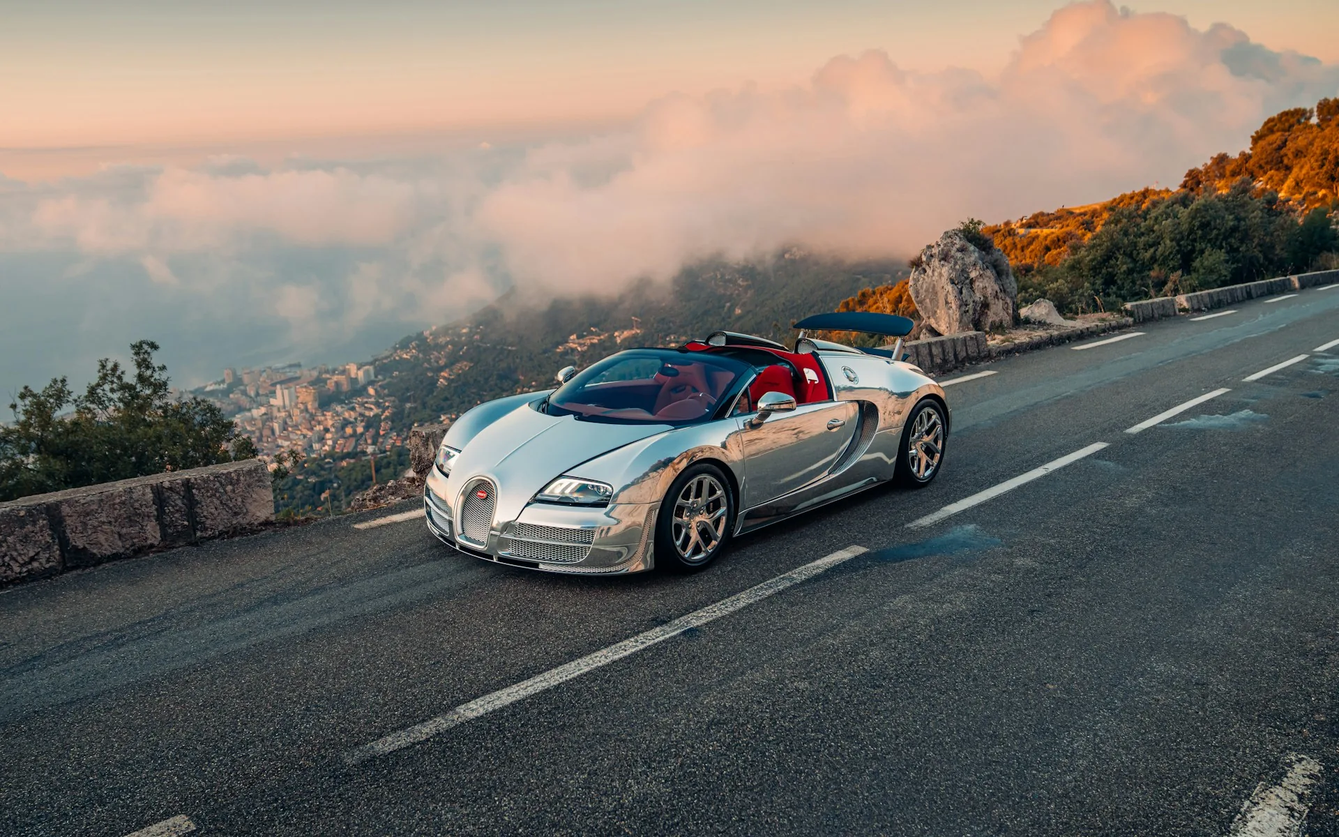 Bugatti Veyron Grand Sport Vitesse with polished aluminium body on a coastal mountain road