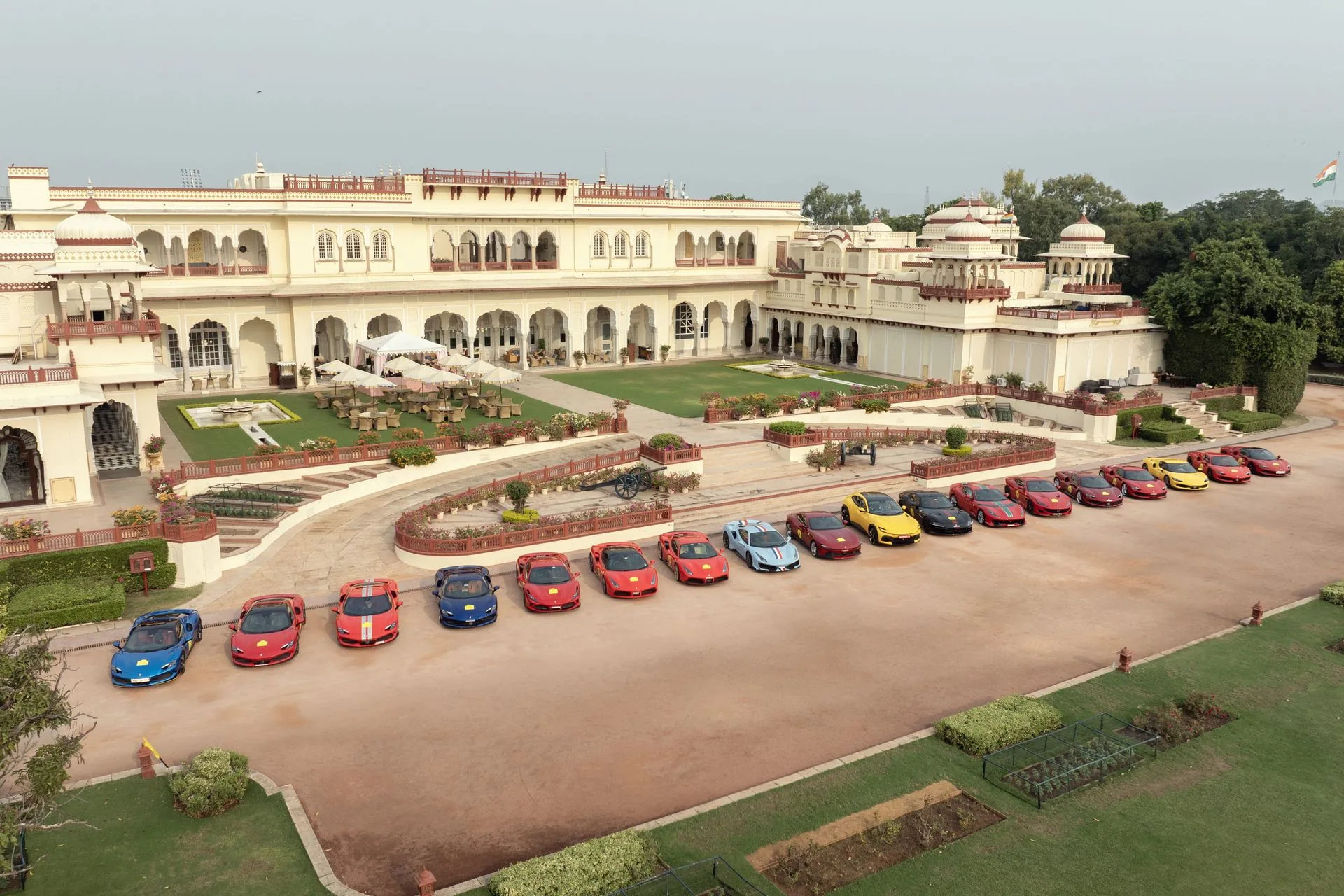Ferrari cars lined up in front of a palace on the drive from Mumbai to New Delhi